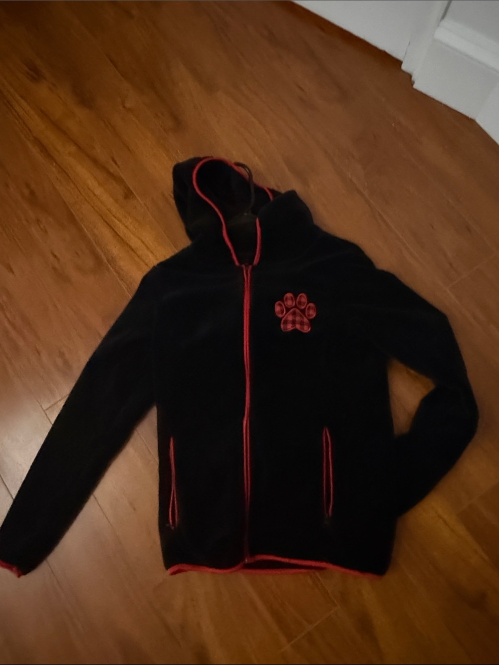 Black Hooded Fleece Jacket with Red Trim and Paw Patch